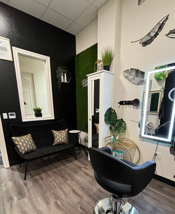 Modern salon waiting area with stylish decor.