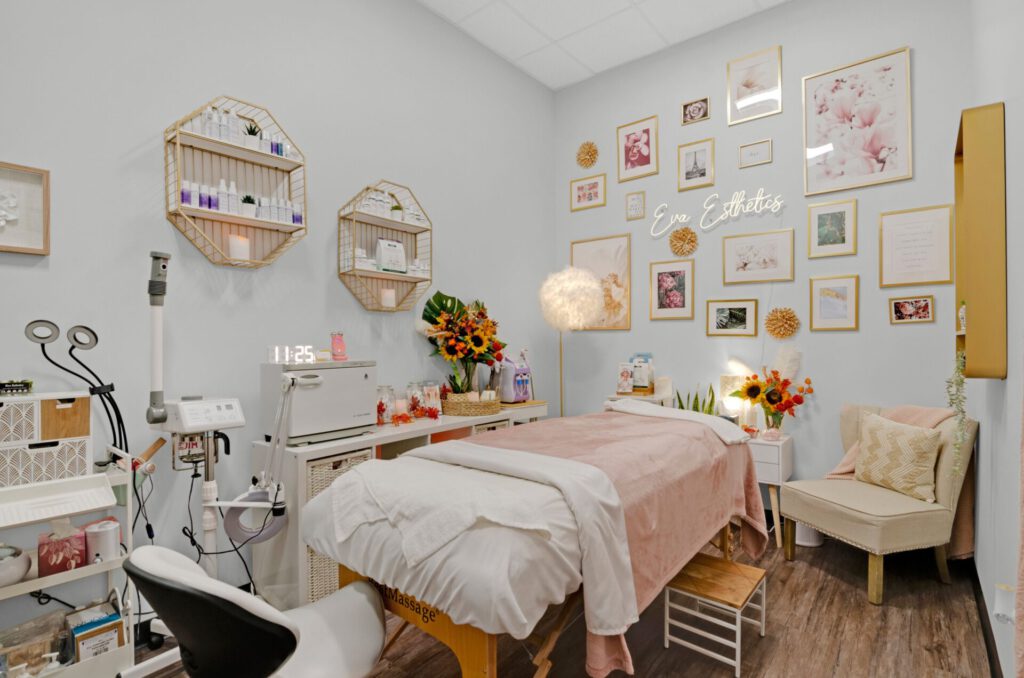 Cozy esthetician room with treatment bed and decor.