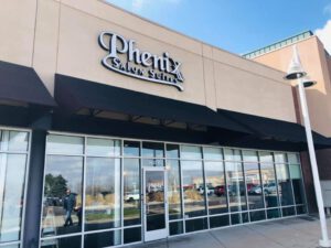 Phenix Salon Suites storefront exterior with logo
