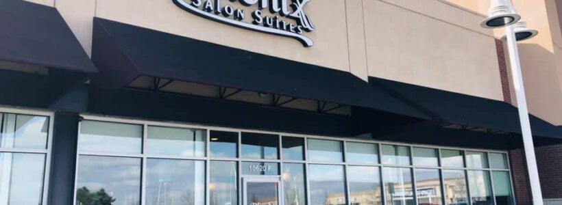 Phenix Salon Suites storefront exterior with logo