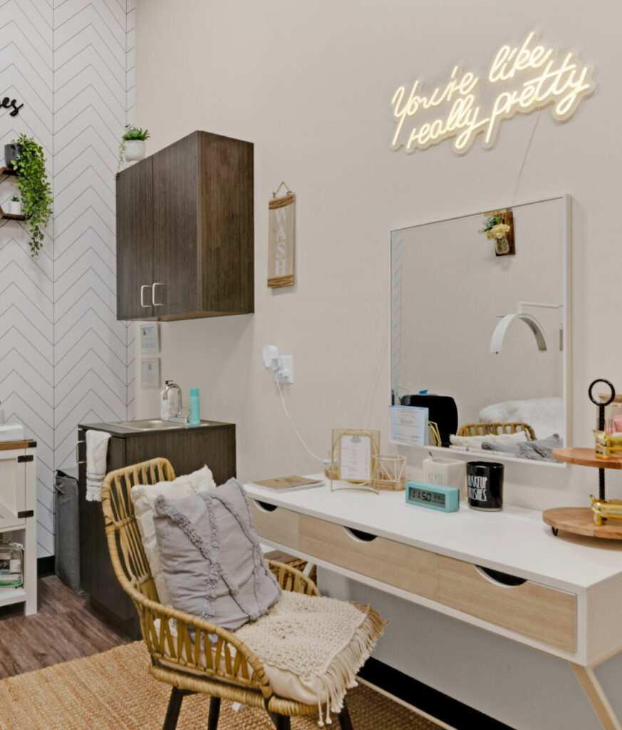 Modern beauty salon with decorative elements and quote.