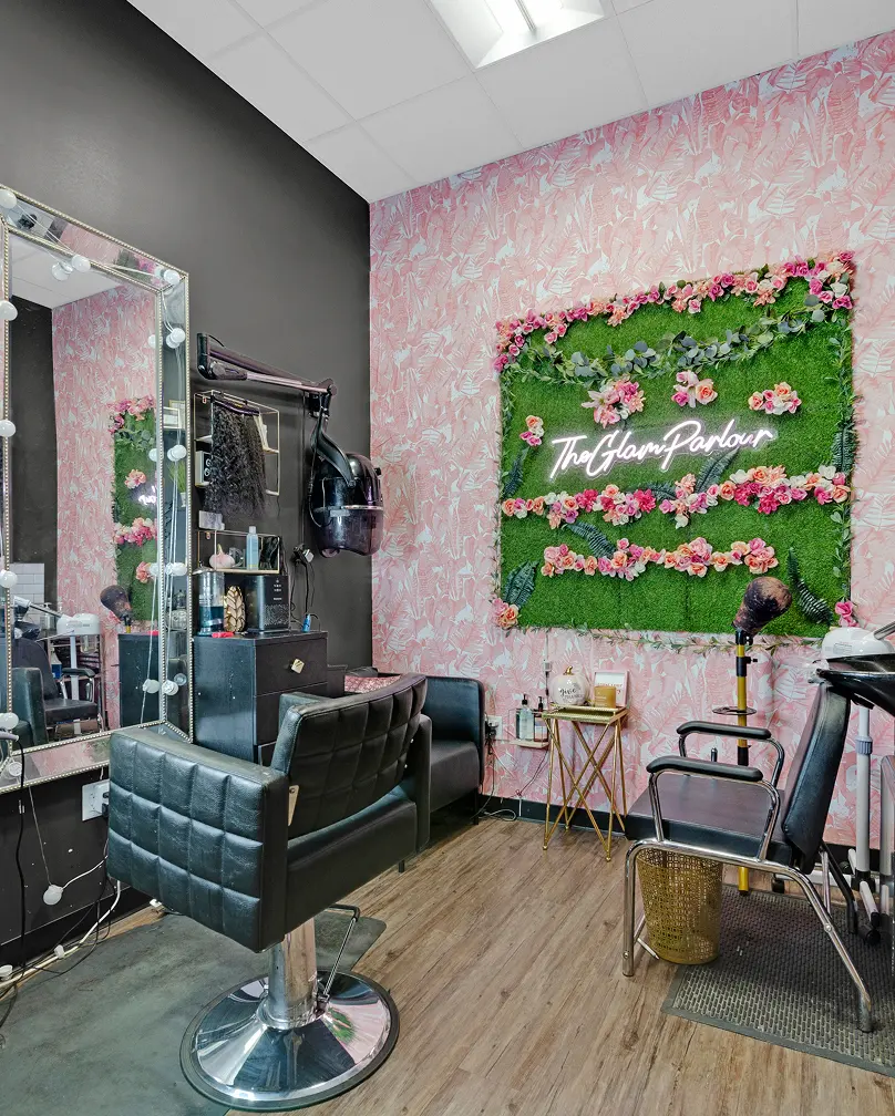 Glamorous hair salon with chic decor and styling chair.