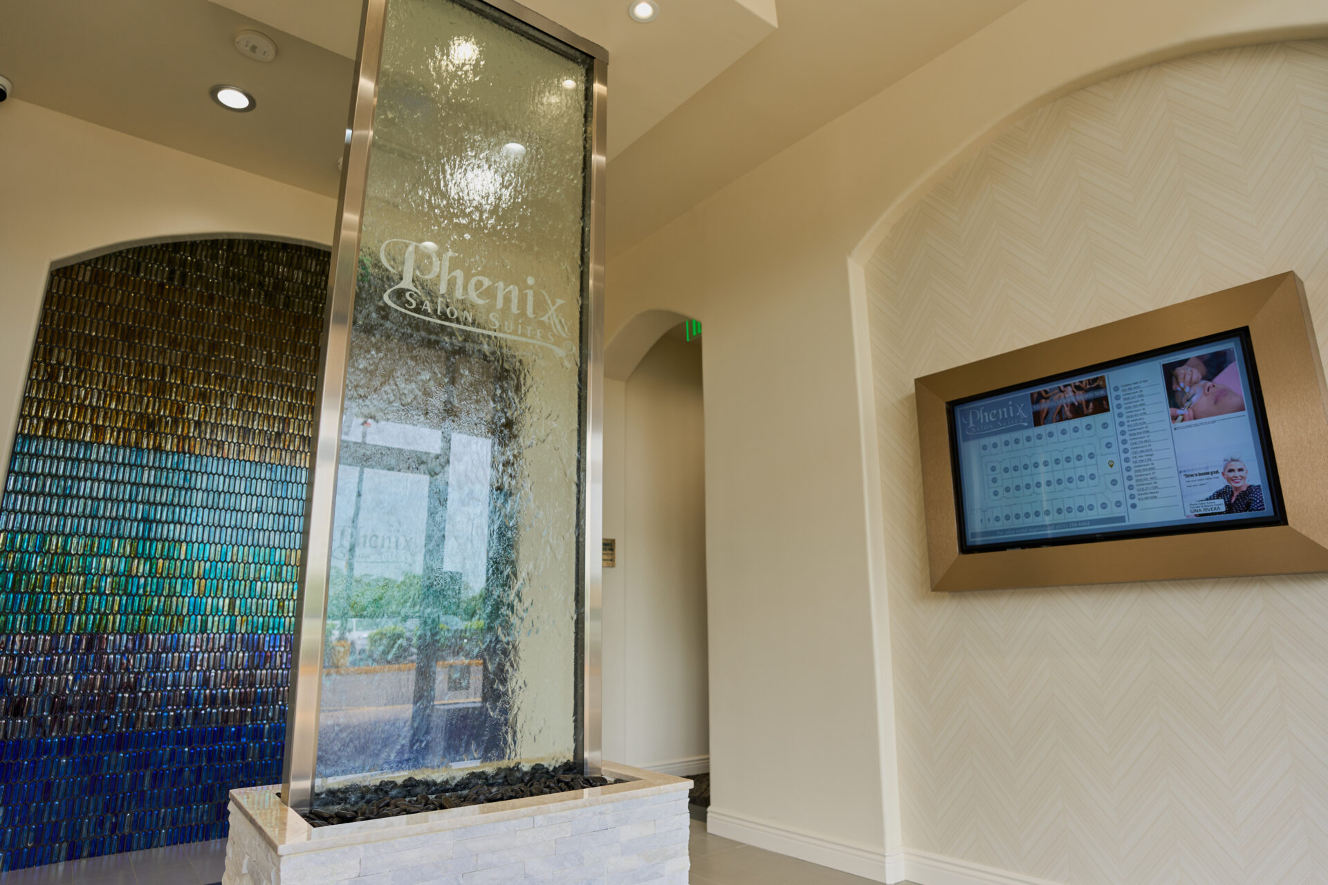 Phenix Salon Suites lobby with decorative waterfall