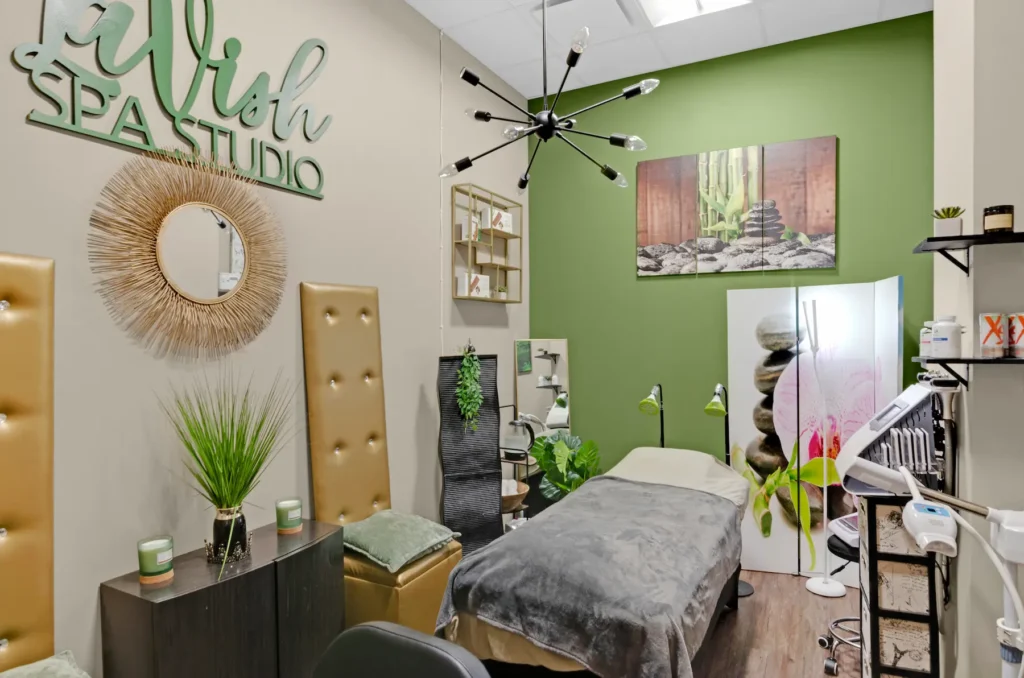Modern spa room with massage table and decor