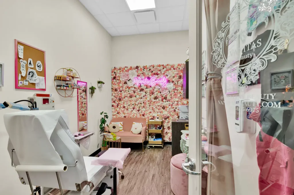 Cozy beauty salon with floral decor and equipment.