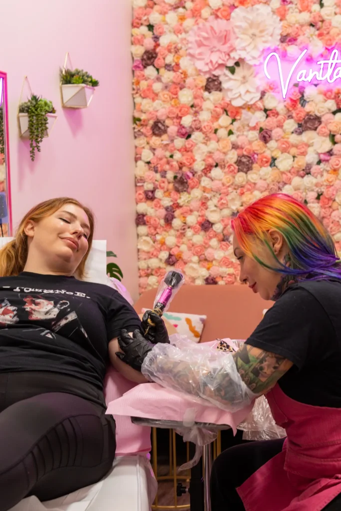 Tattoo artist working in floral studio