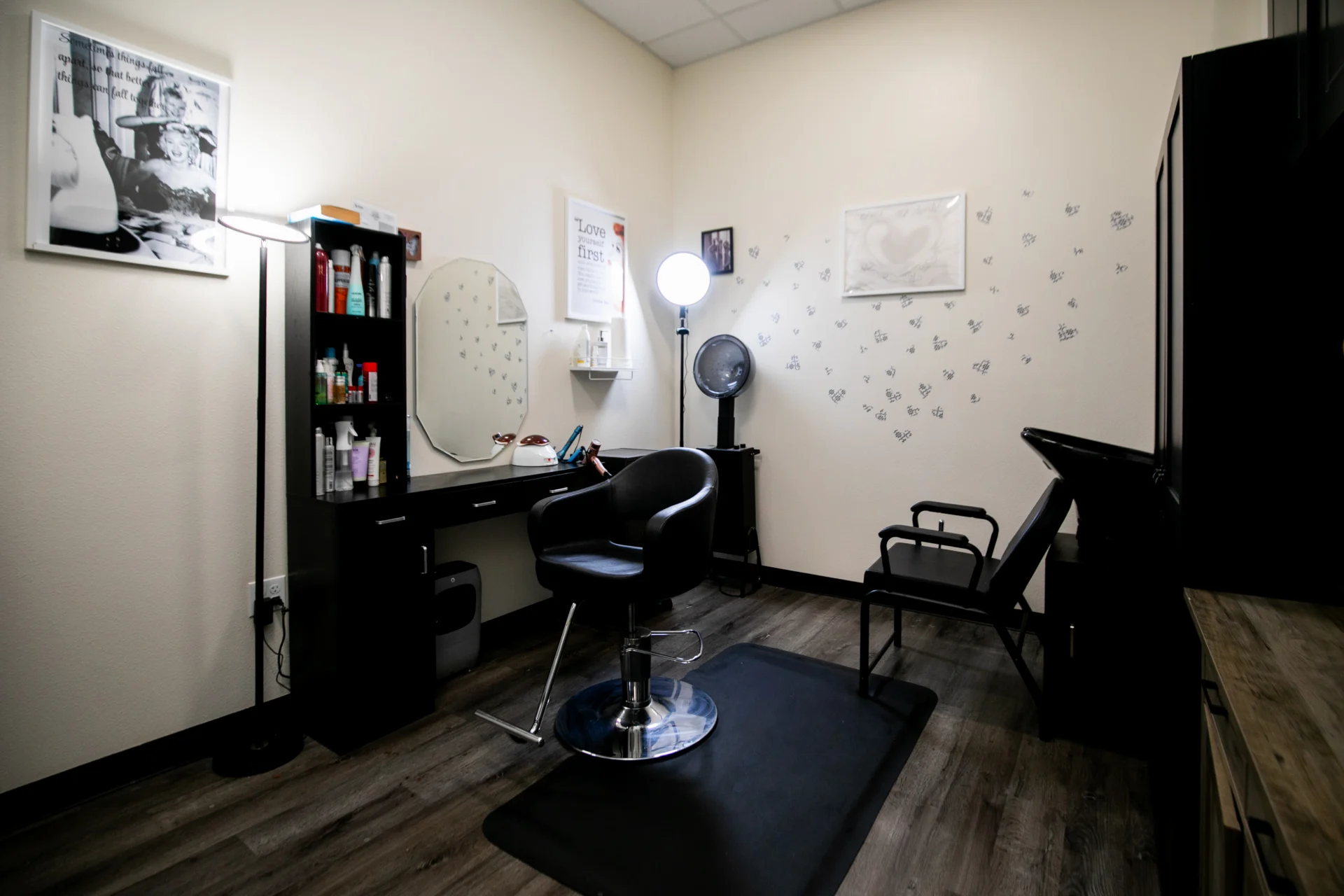 Small hair salon styling station with chair and mirror