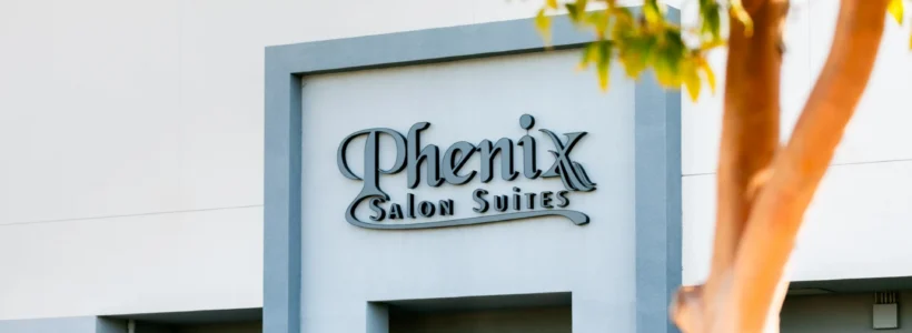 Phenix Salon Suites storefront exterior with tree