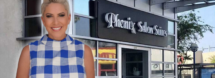 Woman standing outside Phenix Salon Suites storefront